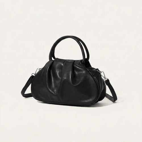 Kompakte Handtasche mit markanter Frontraffung