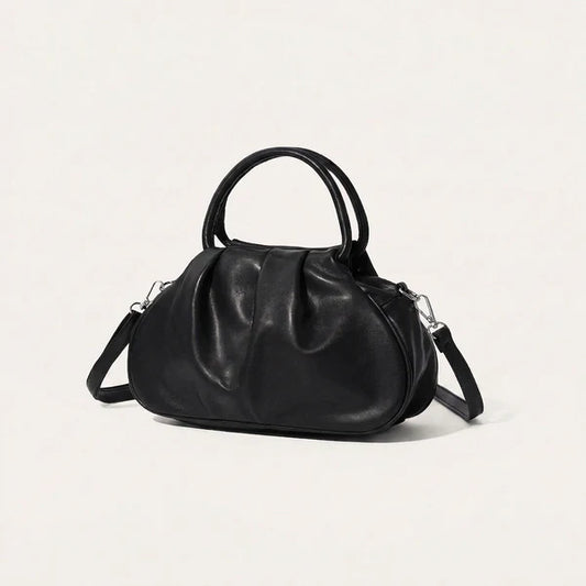 Kompakte Handtasche mit markanter Frontraffung